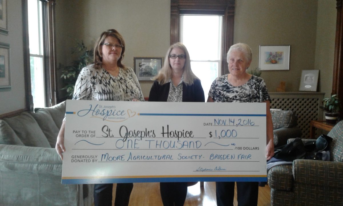 $1,000 donation from charity auction presented to St. Joseph’s Hospice