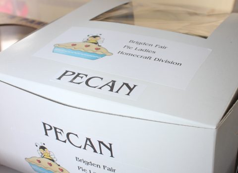A box containing a pecan pie